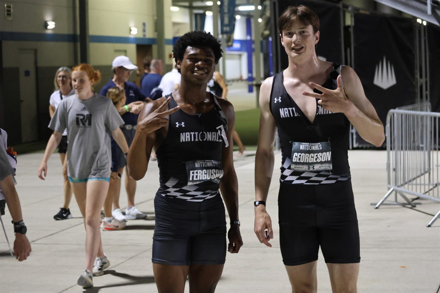 Under Armour Nationals 800m runner-up Nicholas L. Ferguson and third-place Ryan Georgeson celebrate after the 2026 high school boys 800m final at IMG Academy