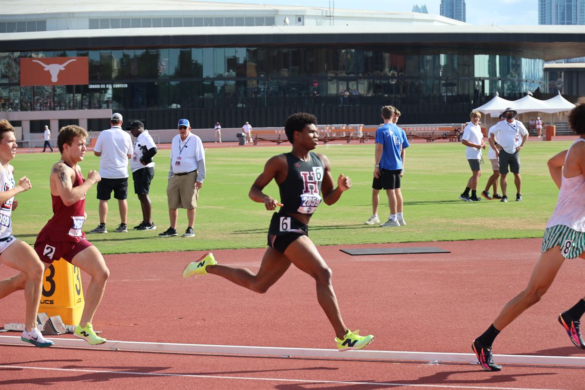 Nicholas L. Ferguson racing the 2026 UIL Texas 6A Boys 800m State Championship at Mike A. Myers Stadium with the Frank Erwin Center in the background