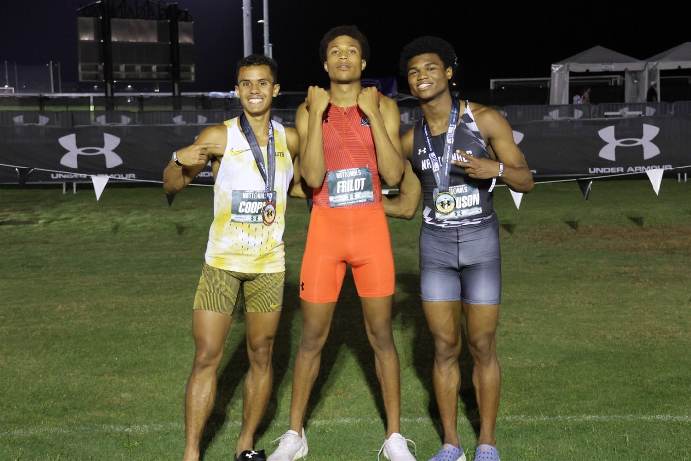 All-American Nicholas L. Ferguson with fellow boys 800m finalists Joshua Cooper and Frilot after the 2026 Under Armour Track & Field Nationals final at IMG Academy